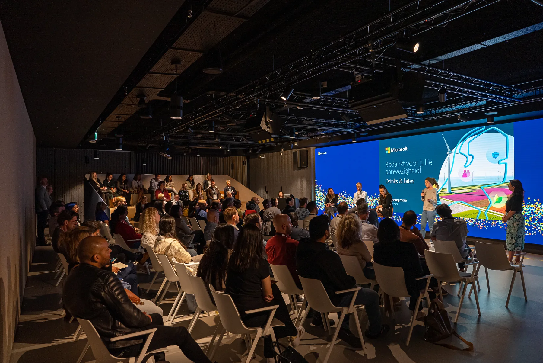 Daphne on stage during a Microsoft partner event.